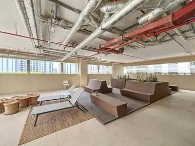 a room with couches and tables in a building at Socio Tower 2 - Neat Two Bedroom in Dubai