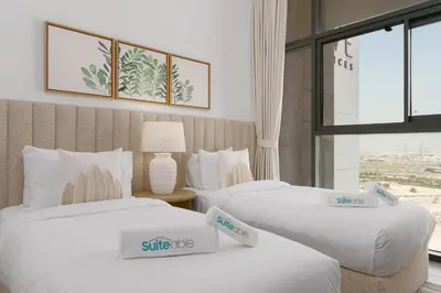 two beds in a hotel room with price signs on them at Your Exclusive Retreat in Dubai Hills by Suiteable in Dubai