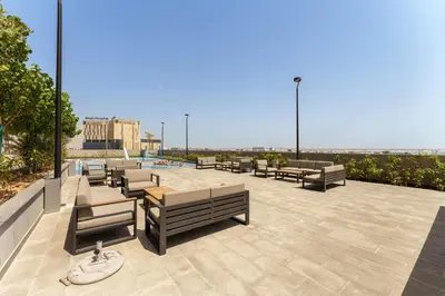 a group of benches sitting on top of a building at Your Exclusive Retreat in Dubai Hills by Suiteable in Dubai