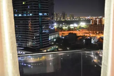 a view of a city at night from a building at Click Stay - JLT - Studio & Balcony Lakes view Entire Apartment -RA in Dubai