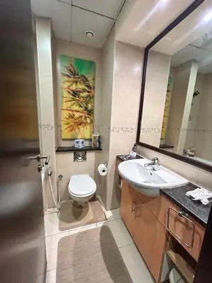 a bathroom with a sink and a toilet and a mirror at Click Stay - JLT - Studio & Balcony Lakes view Entire Apartment -RA in Dubai