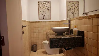 a bathroom with a sink and a toilet at Modern, spacious, Luxe 5BR plus Maid condo in JBR, near JBR Beach, Marina view, By La Buena Vida Holiday Homes in Dubai