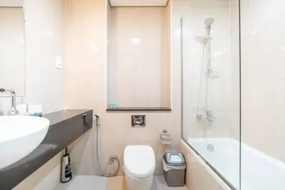 a bathroom with a sink and a toilet and a shower at StoneTree - Spacious Studio - The Matrix in Dubai