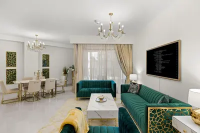 a living room with a green couch and a dining room at 2BR apartment in downtown Dubai, near Burj Khalifa in Dubai