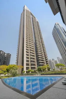 a tall building with a swimming pool in front of it at 2BR apartment in downtown Dubai, near Burj Khalifa in Dubai