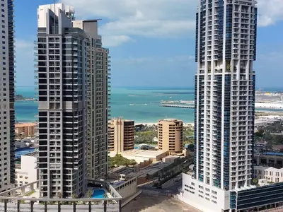 a view of two tall buildings in a city at Comfortable 1BR Apartment in Marina Tower, Dubai Marina by Deluxe Holiday Homes in Dubai