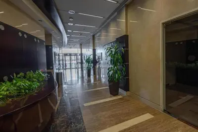 a hallway with potted plants in a building at Click Stay - JLT - Entire Studio & Balcony Lakes view Apartment -AM in Dubai