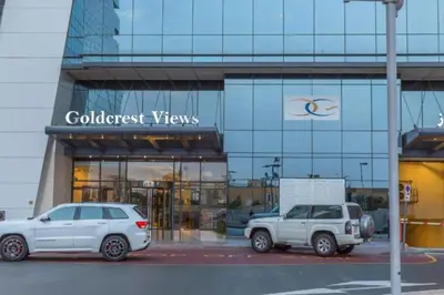 two white cars parked in front of a building at Click Stay - JLT - Studio & Balcony Lakes view Entire Apartment -JN in Dubai