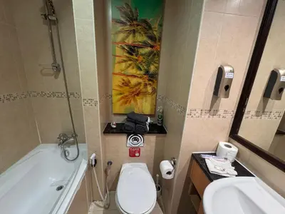 a bathroom with a sink and a toilet and a tub at Click Stay - JLT - Studio & Balcony Lakes view Entire Apartment -JN in Dubai