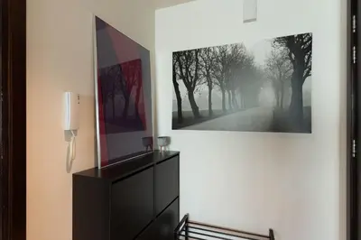 a wall with a picture of a road with trees at Incredible Fountain Views 2.5 BR Burj Residences in Dubai