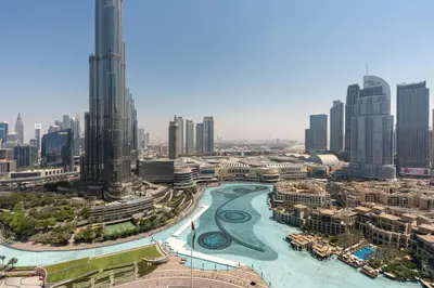 a view of a city with tall buildings at Incredible Fountain Views 2.5 BR Burj Residences in Dubai