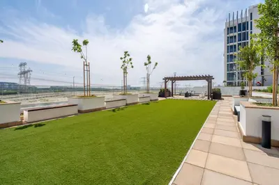 an outdoor patio with grass and a gazebo at GuestReady - Urban Retreat in Downtown in Dubai