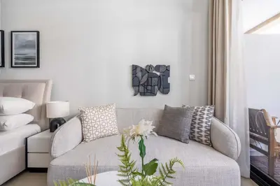 a living room with a couch and a table at GuestReady - Urban Retreat in Downtown in Dubai