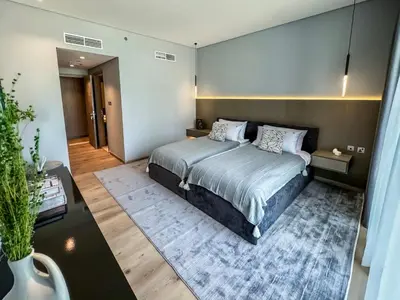 a bedroom with a large bed in a room at Majestic 2BR Haven with Burj Khalifa View in Dubai