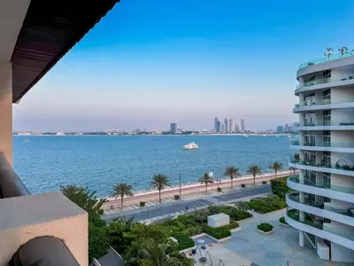 a view of the ocean from a building at Charming Ocean View 1BR Apartment at 5 Star Resort in Dubai