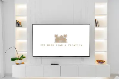 a picture frame on a white wall in a living room at High class apartment in Dubai