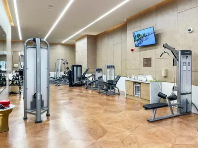 a gym with several treadmills and exercise machines at Stonetree - Full Sea View - Luxury Tower with 5 Star Facilities in Dubai