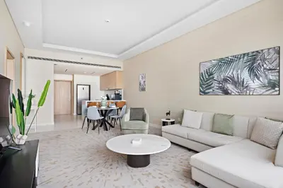 a living room with a couch and a table at Stonetree - Full Sea View - Luxury Tower with 5 Star Facilities in Dubai