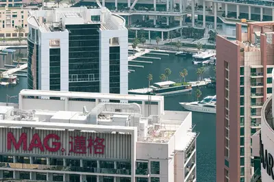 an aerial view of a city with buildings and a harbor at SmartStay at Burj Royale - Unique Downtown Dubai City Views - Brand New Luxury Apartments in Dubai