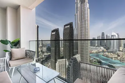 a balcony with a view of a city at Luxury 3BHK, Burj Khalifa & Dancing fountain view in Dubai
