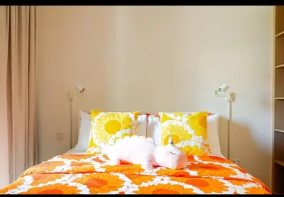 a white stuffed animal sitting on top of a bed at Exquisite 1-Bedroom with Pool Scenery in Dubai Creek Harbour in Dubai