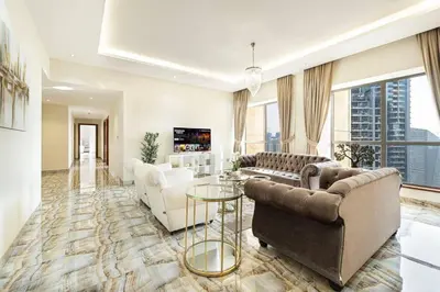 a living room with two couches and a table at Luxury 4-Bedroom with Maids Room, Marina and Ain Dubai Views in Dubai