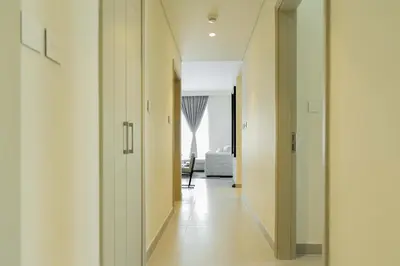 a hallway with white walls and white floors at Sleeps 8 Private Cinema World Island Views in Dubai