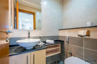 a bathroom with a sink and a toilet at Luxury 3BR in Ocean Heights, Dubai Marina by Deluxe Holiday Homes in Dubai