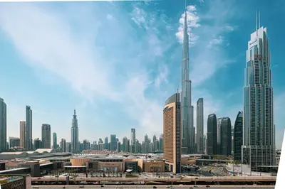 a view of a large city with skyscrapers at Burj Khalifa View & Dubai Mall Connection in Dubai