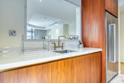 a kitchen with a sink and a counter top at RH - Beautiful & Spacious furnished 01 BR, Walk away from Dubai Mall in Dubai