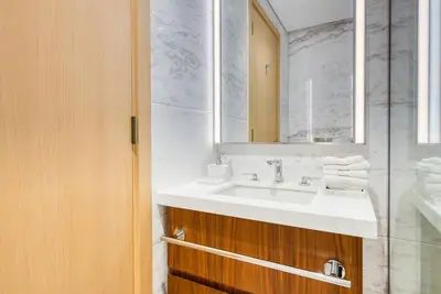 a bathroom with a sink and a mirror at RH - Beautiful & Spacious furnished 01 BR, Walk away from Dubai Mall in Dubai