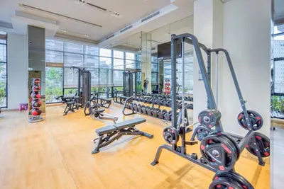 a gym with a lot of treadmills and machines at RH - Beautiful & Spacious furnished 01 BR, Walk away from Dubai Mall in Dubai