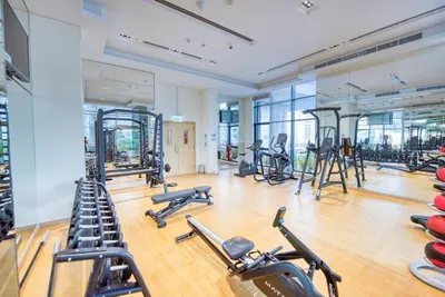 a gym with several treadmills and exercise bikes at RH - Beautiful & Spacious furnished 01 BR, Walk away from Dubai Mall in Dubai