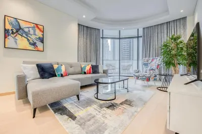a living room with a couch and a table at RH - Spacious chic apartment, Next to Dubai Mall in Dubai