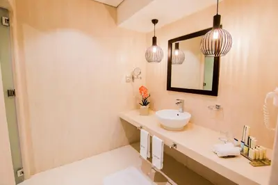 a bathroom with a sink and a mirror at Signature Hotel Al Barsha in Dubai