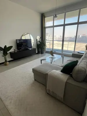 a living room with a couch and a large window at Specious cosy bedroom in Al Sufouh in Dubai