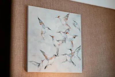 a painting of a flock of birds flying at Dubai Marina Delight: Spacious Retreat for Groups in Dubai