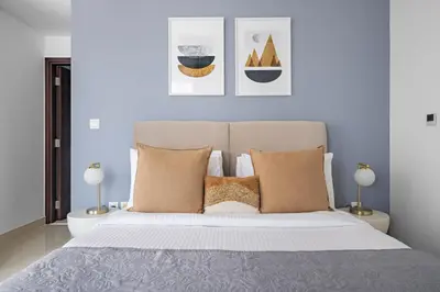 a bedroom with a large white bed with pillows at Silkhaus Modern 1 BDR With Easy Access to Downtown in Dubai