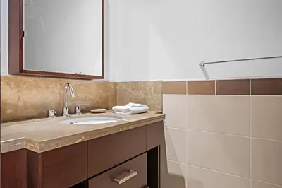 a bathroom with a sink and a mirror at Silkhaus Modern 1 BDR With Easy Access to Downtown in Dubai