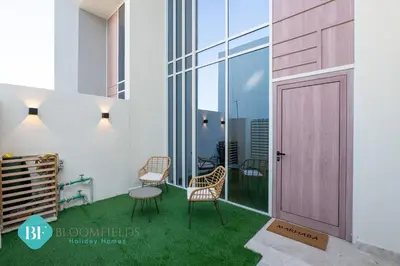 a rendering of a balcony with a pink door at Bloomfields Premium 1br Duplex In Rukan in Dubai