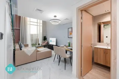 a living room with a couch and a table at Bloomfields Premium 1br Duplex In Rukan in Dubai