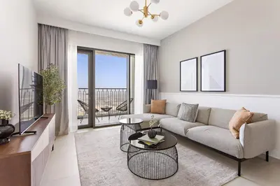 a living room with a couch and a tv at Silkhaus High Floor Luxury 1BDR in New Tower in Dubai