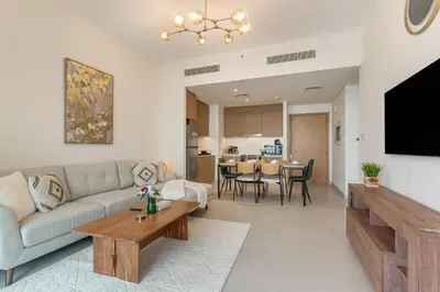 a living room with a couch and a table at Spacious 1-Bedroom in Summer, Lagoon Access Feature - Allsopp&Allsopp in Dubai