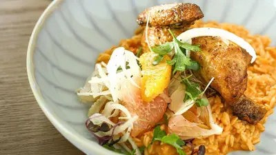 a bowl of food with chicken and rice at InterContinental Residences Dubai Business Bay by IHG in Dubai