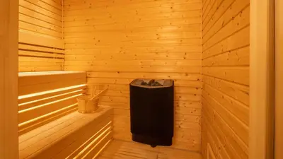a wooden sauna with a trash can in it at InterContinental Residences Dubai Business Bay by IHG in Dubai