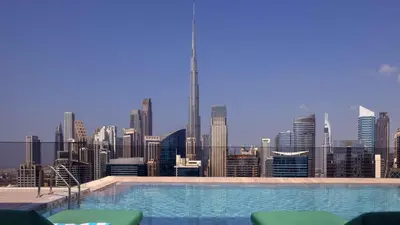 a swimming pool with a view of a city skyline at InterContinental Residences Dubai Business Bay by IHG in Dubai