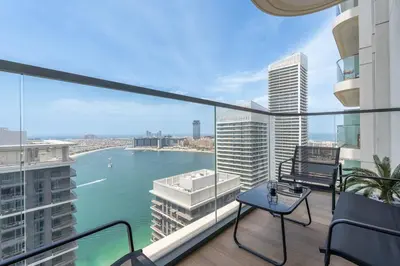 an apartment balcony with a view of the water at Czechin * Brand New * BeachFront * Palm View * High Floor in Dubai