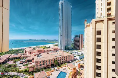 an aerial view of a city with buildings and the ocean at Sound of the Waves in JBR by Lagom in Dubai