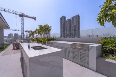 a kitchen on a balcony with a view of a city at New Listing * Pool & Marina Skyline View * TOP Amenities in Dubai