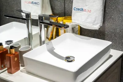 a white sink in a bathroom next to a mirror at New Listing * Pool & Marina Skyline View * TOP Amenities in Dubai